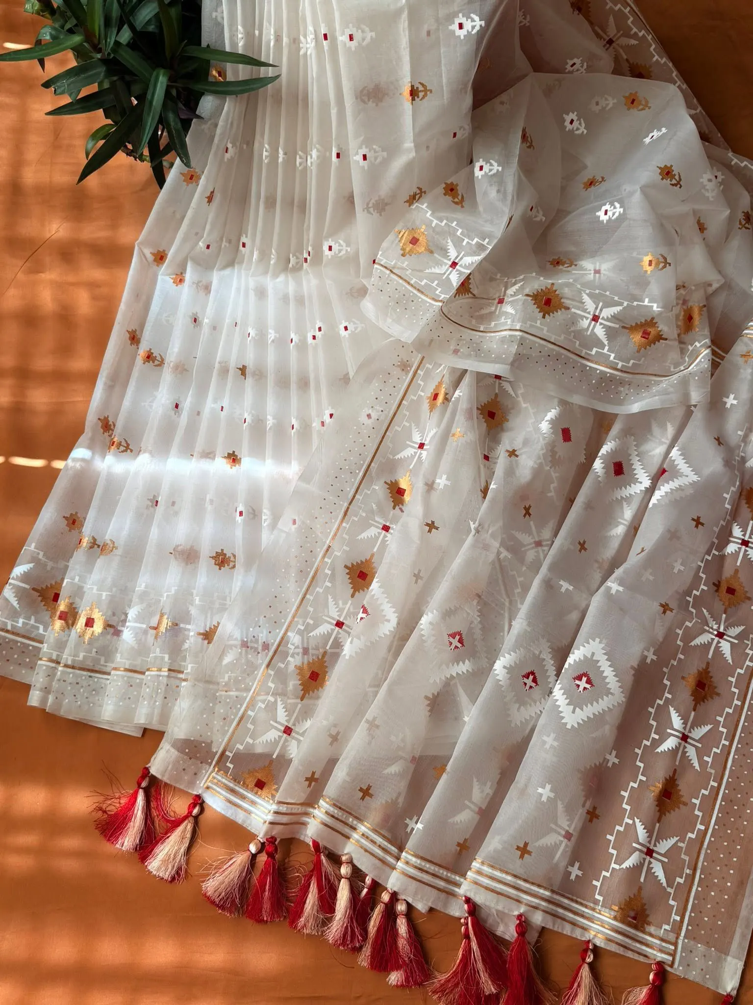 Ivory White Geometric Motif Saree with Red Tassels